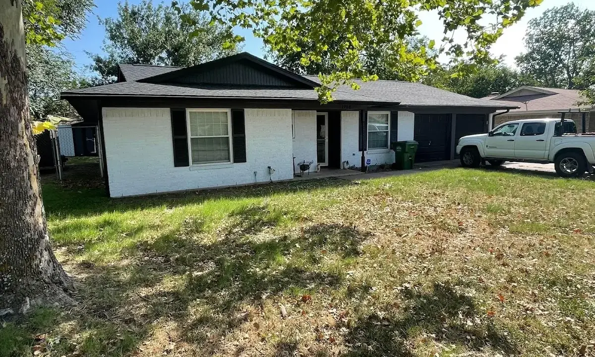 Professional roofing crew working on a residential roof in Aiea